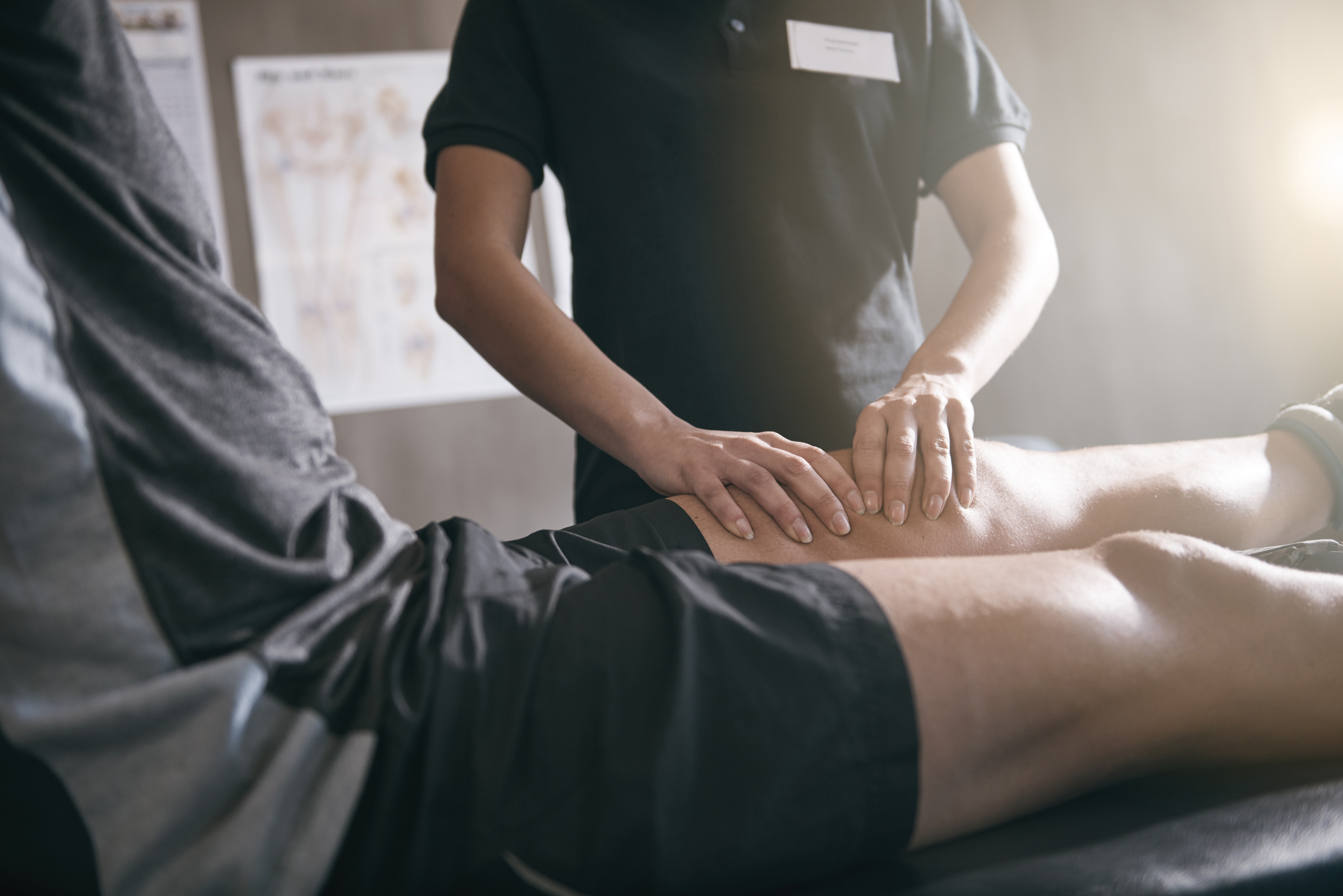 Sports medicine provider examining patient