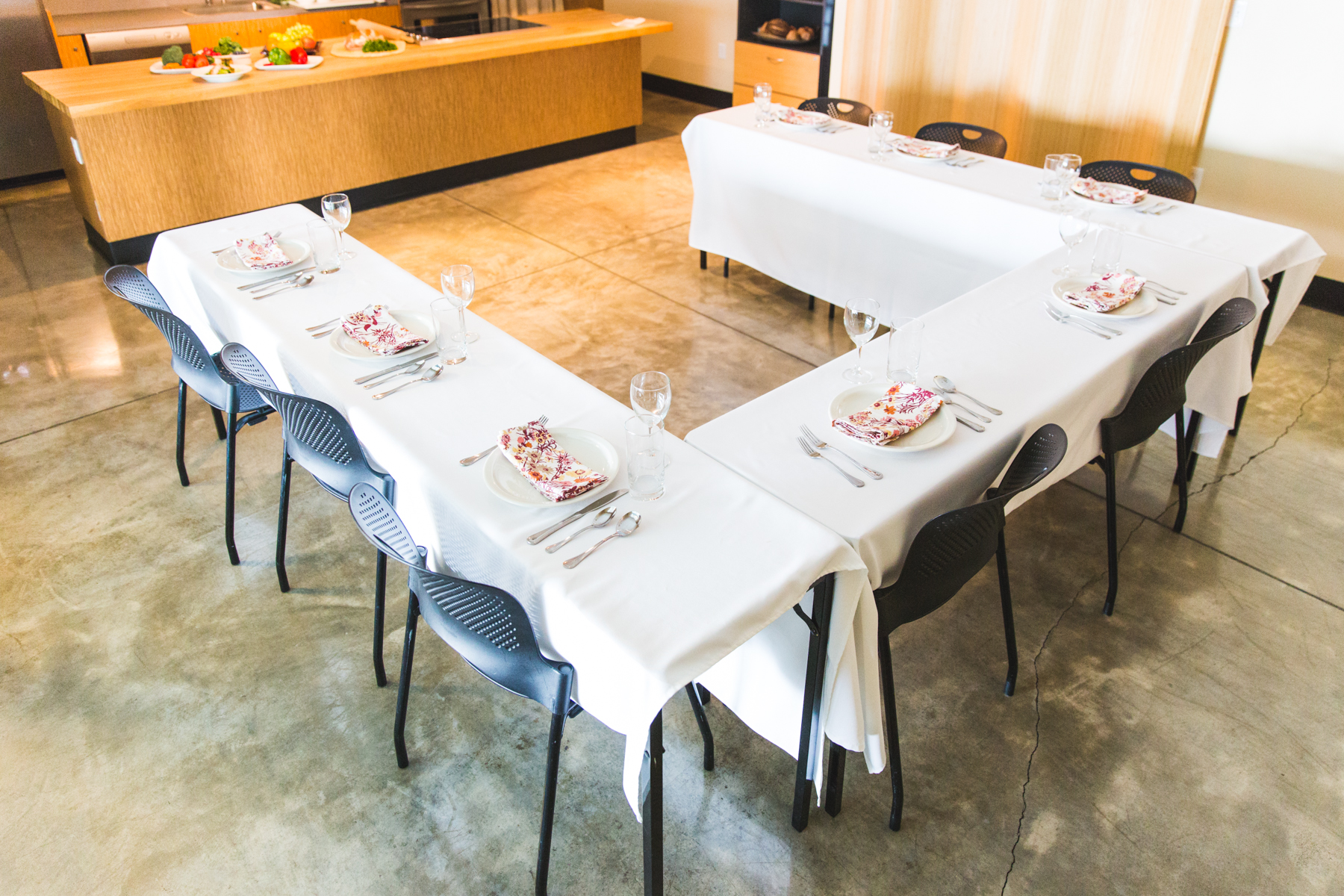 U-shaped banquet table with 8 place settings.