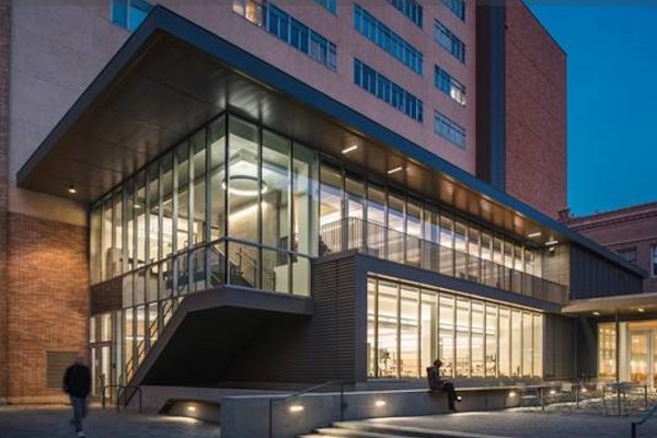 Brick and glass building at night.