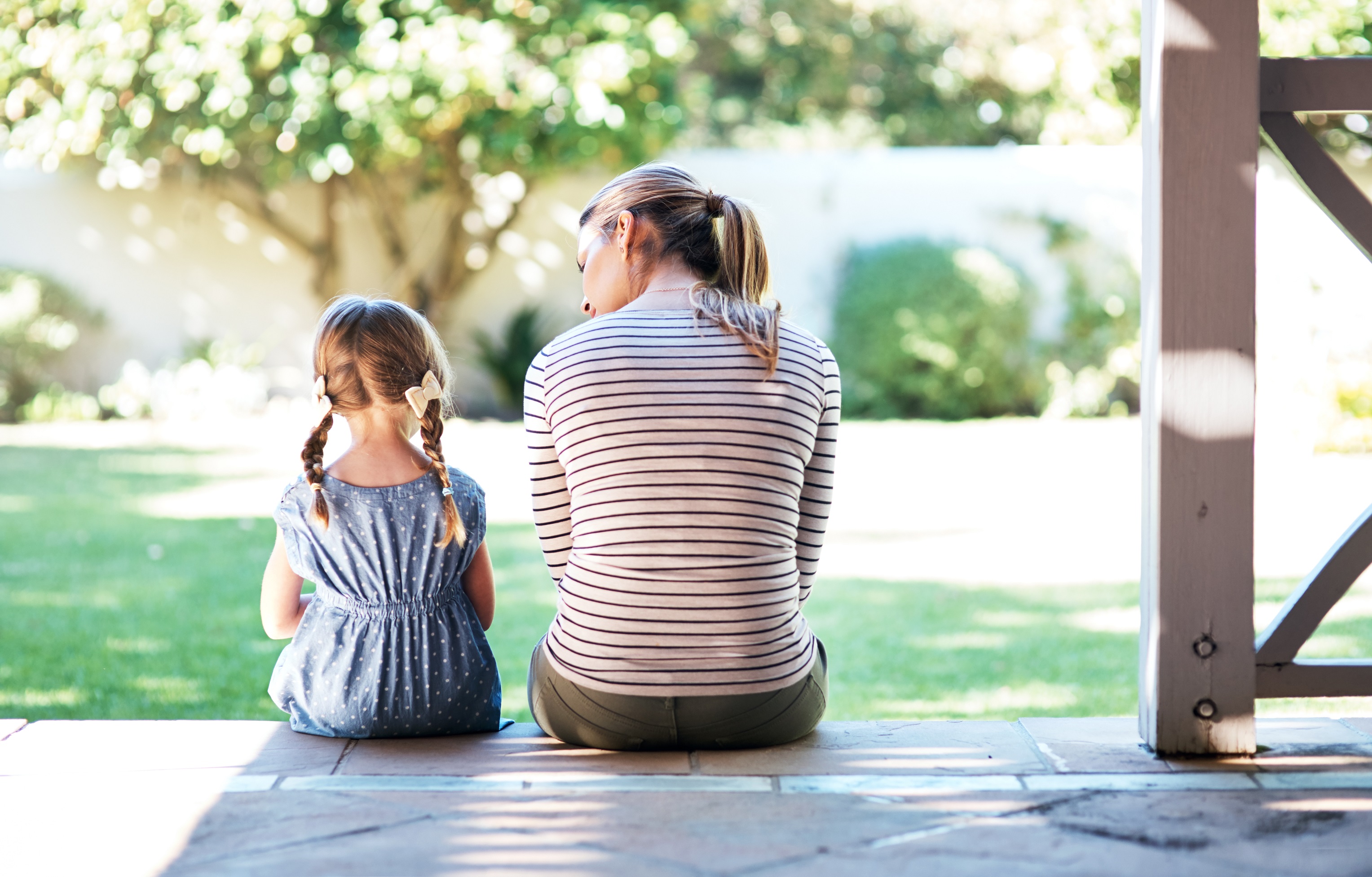 Mother and Child sitting on porch