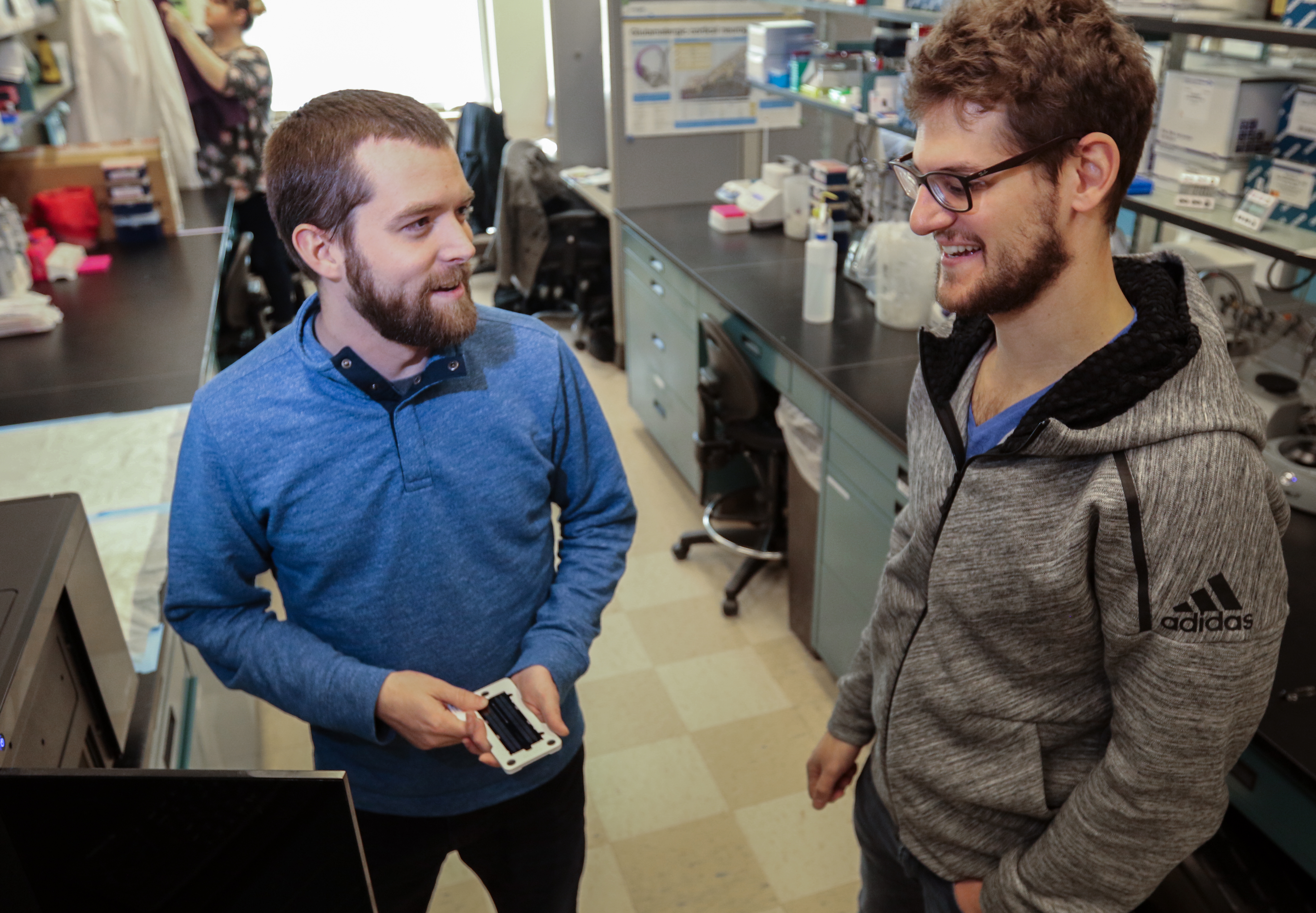 Photo of Dr. Andrew Adey and a student in the lab. 