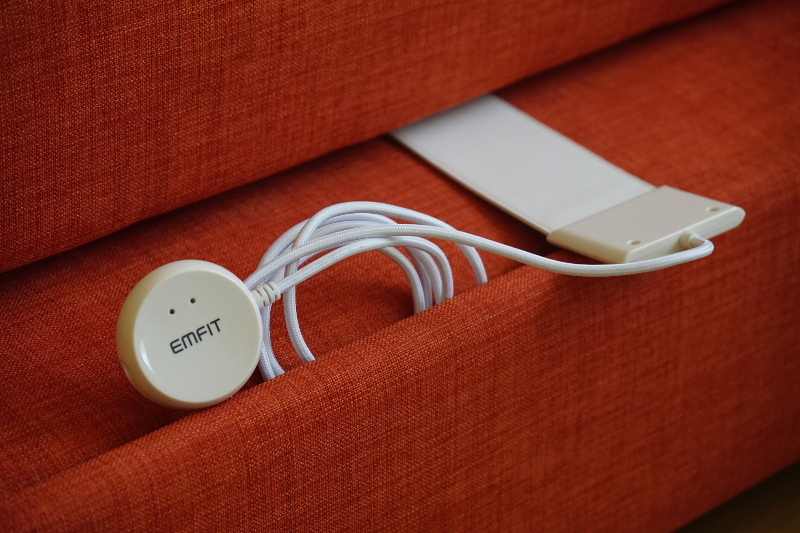 An ORCATECH sleep sensor sits underneath a mattress. It measures an individual's sleep patterns. 