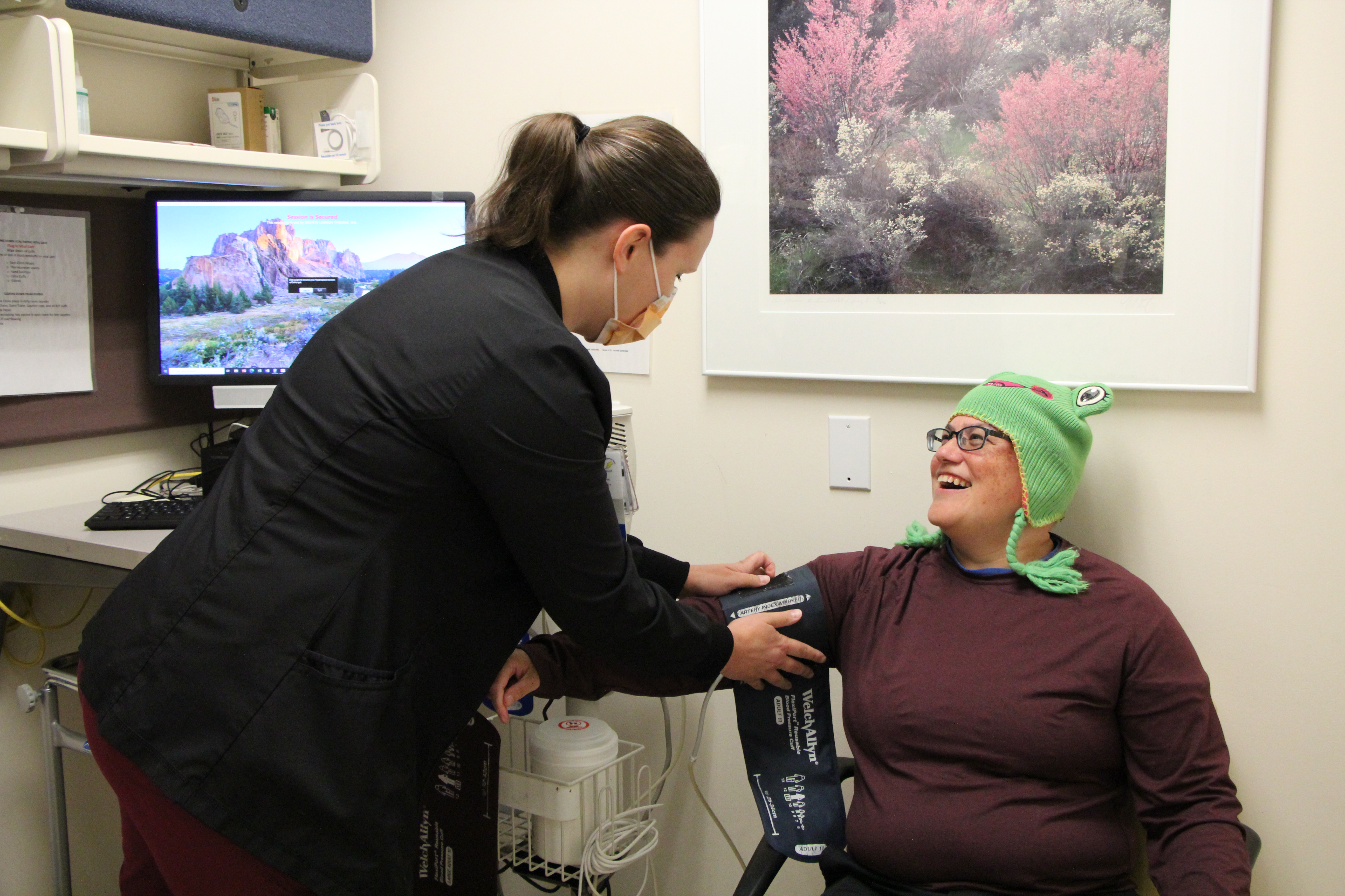 Photograph of a nurse taking a patient's blood pressure