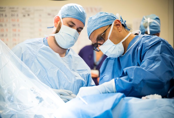 Dr. Ahmed Raslan in a surgery suite.