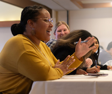 A first-year student participating in a lecture