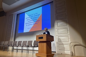 Speaker Andrea Cedfeldt on stage delivering opening remarks for 2024 FD Summit