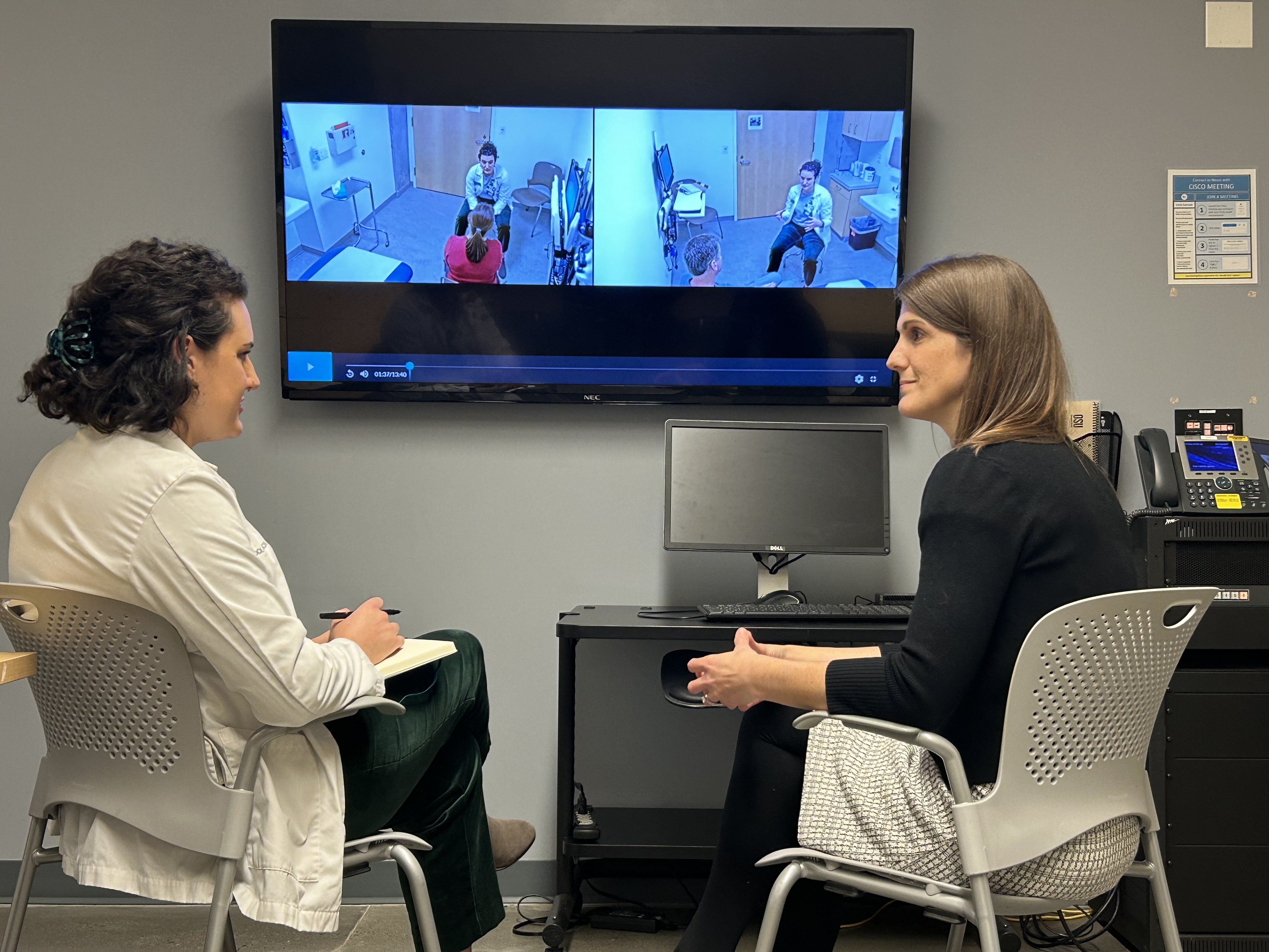 Medical student Olivia Curl, Class of 2024, meets with Dr. Katie Stowers for feedback during medical student testing of communication skills.