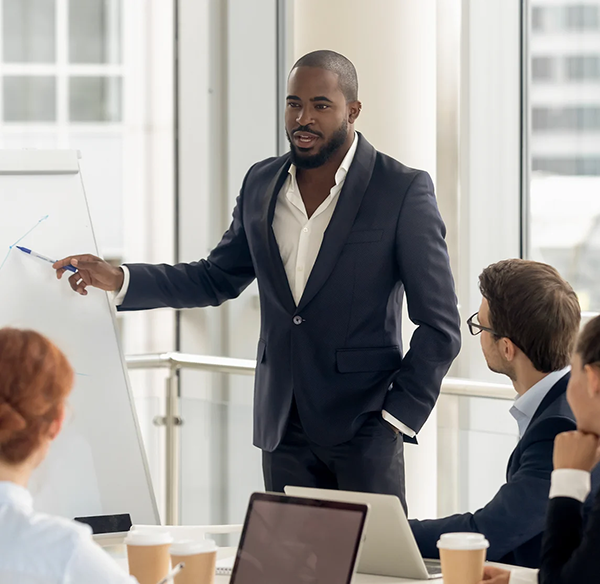 Person leading a meeting in a conference room.