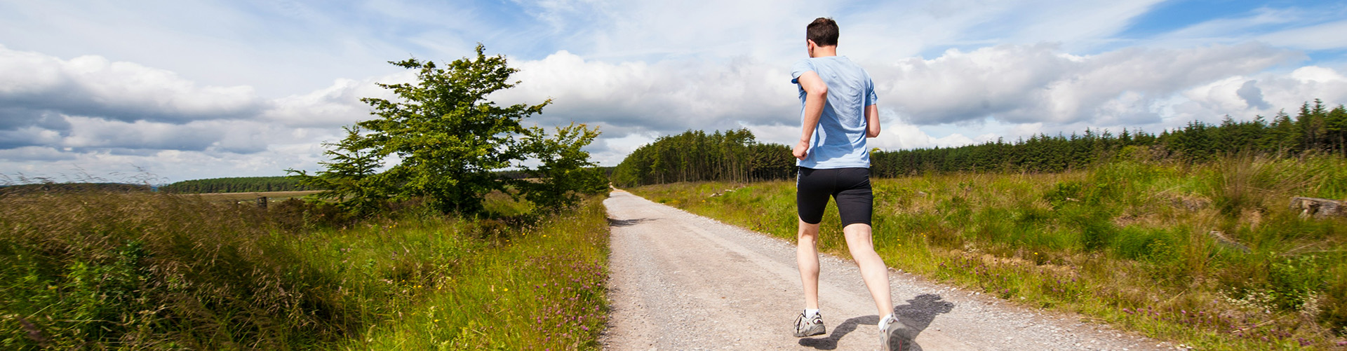 Man running down a rural road
