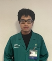Man wearing green coat