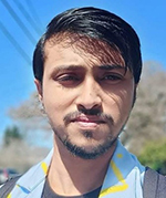 Rudranil Dutta outside on a sunny day.