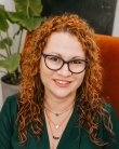 Image of smiling female wearing glasses