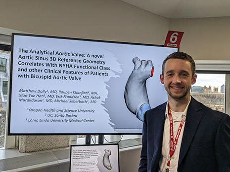 Dally London posing with presentation poster