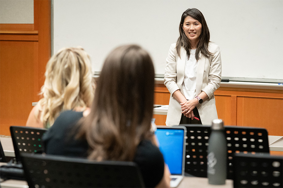 OHSU faculty member teaching students in a small classroom setting.