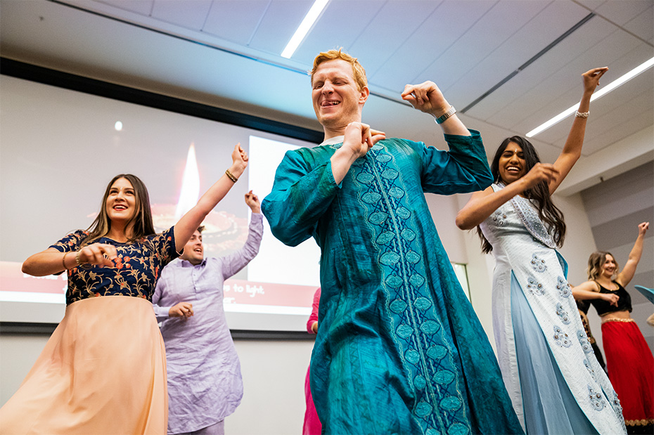 Students enjoy dance lessons during a celebration of Diwali.