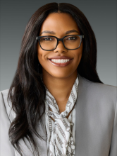A professional headshot of Sydnee Vaughan.