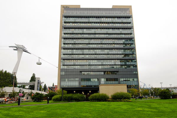 Tall building with the ariel tram to its left 